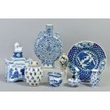 A CHINESE BLUE AND WHITE MOON FLASK, having dragon handles, floral decoration on white ground,
