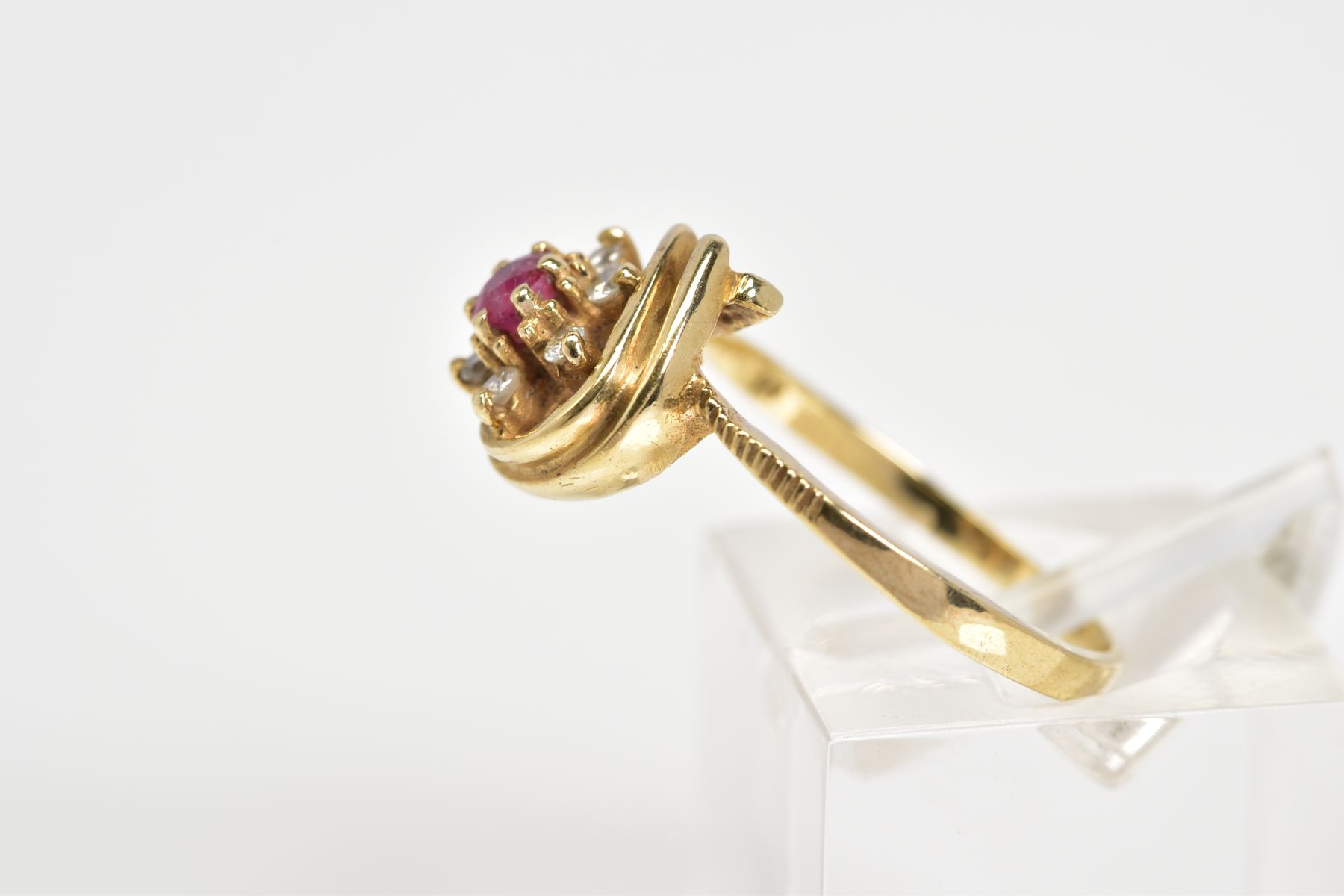 A 9CT GOLD CLUSTER RING, designed as a flower with a central circular cut ruby and brilliant cut - Image 2 of 3