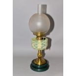 A TWIN BURNER OIL LAMP, having vaseline glass reservoir in basket weave pattern, the brass mount