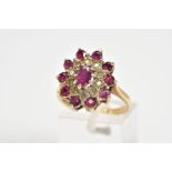 A 9CT GOLD CLUSTER RING, designed with a central oval cut garnet and single cut diamond and circular