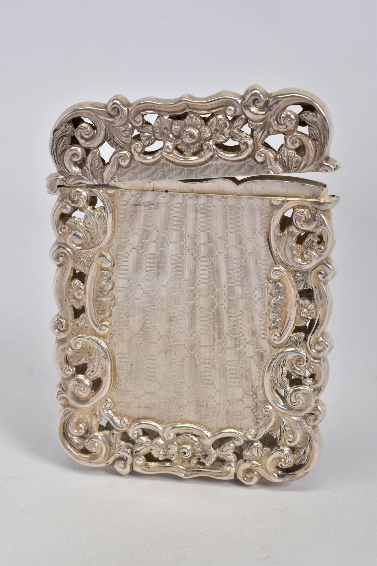 A VICTORIAN SILVER CARD CASE OF PIERCED AND WAVY RECTANGULAR FORM, engine turned decoration with - Image 2 of 2