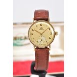 A 9CT GOLD MARVIN WRISTWATCH, the round deteriorated cream dial with gold Arabic numerals and