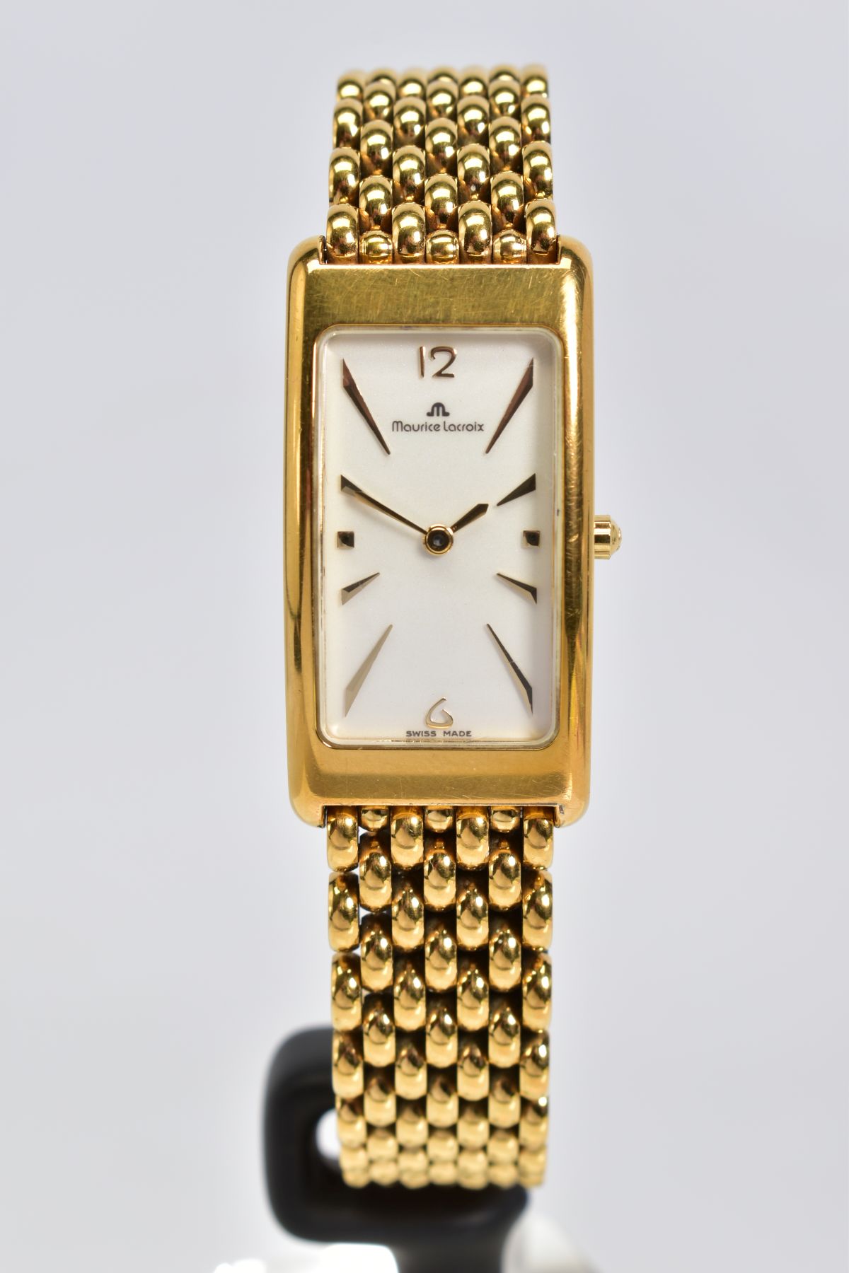 A GOLD PLATED MAURICE LACRIOX WRISTWATCH AND BOX, white dial with baton and Arabic numeral