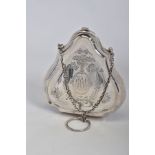 A GEORGE V SILVER PURSE, engraved with ribbons, swags and oval cartouches, one with initials, tan