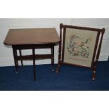 AN EDWARDIAN MAHOGANY DROP LEAF SUTHERLAND TABLE together with an oak firescreen (2)