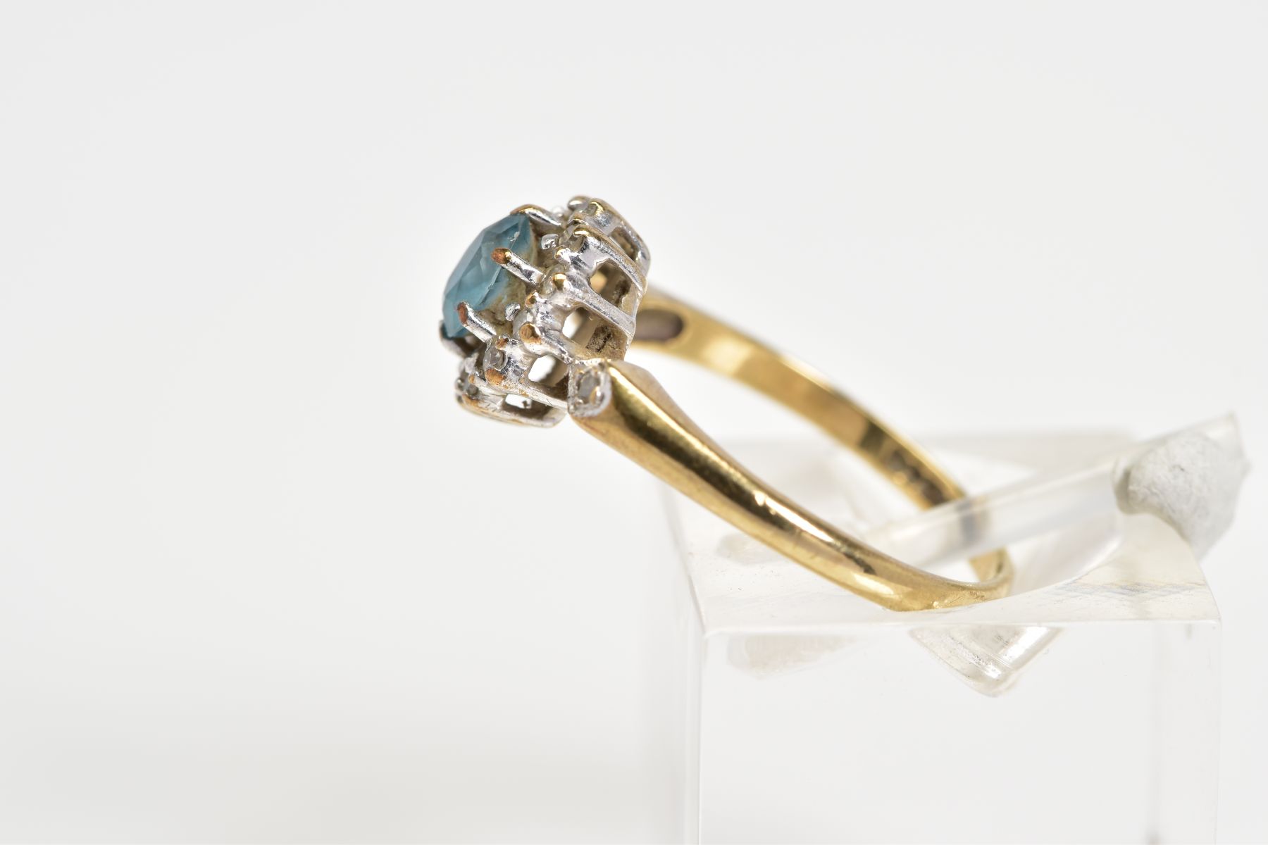 A 9CT GOLD CLUSTER RING, designed with a central oval cut blue topaz and single cut diamond surround - Image 2 of 3