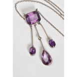 AN AMETHYST SET PENDANT NECKLACE, pendant designed with a cushion cut amethyst which suspends