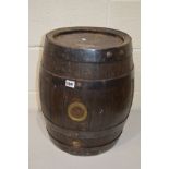 A SMALL VINTAGE COOPERED WHISKY BARREL, with wrought iron banding, diameter 39cm x height 44cm
