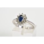 A SAPPHIRE AND DIAMOND OVAL CLUSTER RING, sapphire measuring approximately 6mm x 4mm, estimated