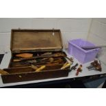 A VINTAGE WOODEN CARPENTERS TOOL BOX and a plastic tray containing vintage handtools including
