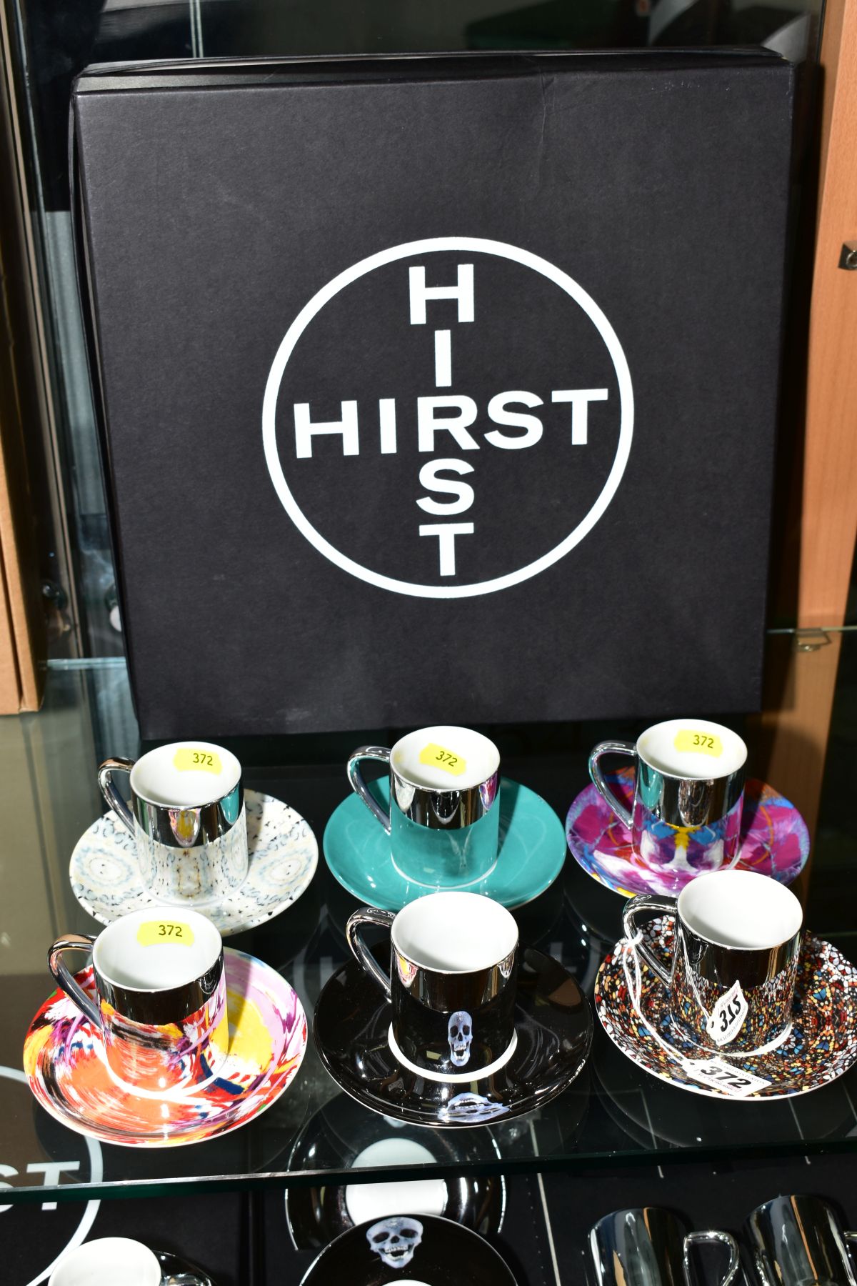 DAMIEN HIRST (BRITISH 1965), A PORCELAIN ESPRESSO SET comprising six different design saucers and