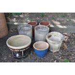 SEVEN GARDEN PLANTERS, including a pair of terracotta pipes, 26cm diameter x 32cm high, a pair of