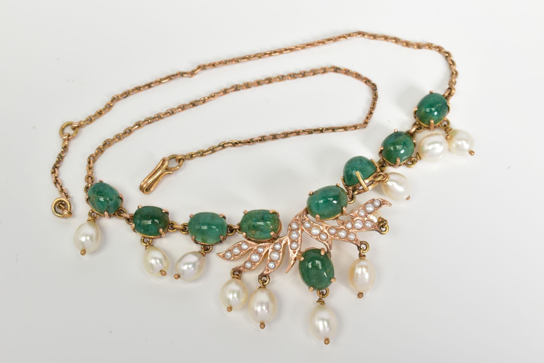 AN EMERALD AND PEARL FRINGE NECKLET, oval cabochon cut emeralds measuring approximately 9mm x 6mm to