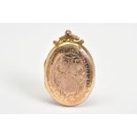 AN OVAL ENGRAVED LOCKET, a hinged locket with a 9ct gold back and front, featuring floral
