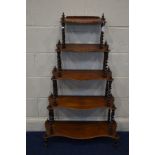 A VICTORIAN ROSEWOOD GRADUATING FIVE TIER SERPENTINE WHATNOT, with each level joined by barley twist