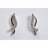 A MODERN PAIR OF DIAMOND STUD EARRINGS, estimated total modern round brilliant cut weight 0.20ct,