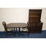 A DARK OAK GATE LEG TABLE, four wheel back chairs and a matching dresser with two drawers (6)
