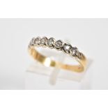 A DIAMOND HALF ETERNITY RING, set with a row of round brilliant cut diamonds, each within a