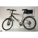 A GT OUTPOST ALL TERRA MOUNTAIN BIKE with twenty four gears, front and rear disc brakes, front