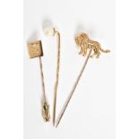 A SELECTION OF HAT PINS, the first in the form of a lion, with a 9ct hallmark for London, the second