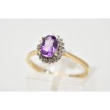 A 9CT GOLD CLUSTER RING, designed with a central oval cut amethyst and single cut diamond
