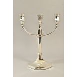 A GEORGE VI SILVER CANDELABRUM, three branch with two shaped octagonal candleholders and an engraved