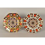 TWO ROYAL CROWN DERBY IMARI OCTAGONAL PLATES, '1128' pattern, one gold banded, diameters 22.5cm (2)