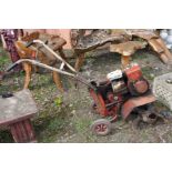 A VINTAGE GARDENCARE 5000 PETROL GARDEN TILLER, with a Briggs & Stratton engine with two 35cm
