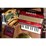 A HOHNER MIGNON 2 ACCORDIAN in pearl red, a German Modern concertina, a Huang Chromatic Harmonica