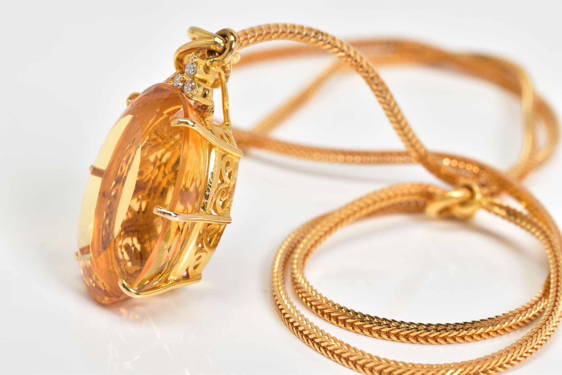 A LARGE CITRINE AND DIAMOND PENDANT AND CHAIN, oval mixed cut citrine stone measuring - Image 3 of 3