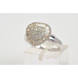 A DIAMOND RING, of heart shape design, the central raised panel set with round brilliant cut