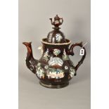 A LATE VICTORIAN MEASHAM BARGEWARE TREACLE GLAZED TEA POT, applied with birds, baskets of flowers,