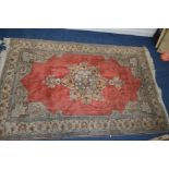 A 20TH CENTURY KAYSERI TURKISH RUG, of red ground, central lozenge, floral design and multi strap