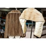 AN OFF WHITE CONEY SHRUG, with a beige faux fur evening jacket by ASTRAKA, under arm to under arm