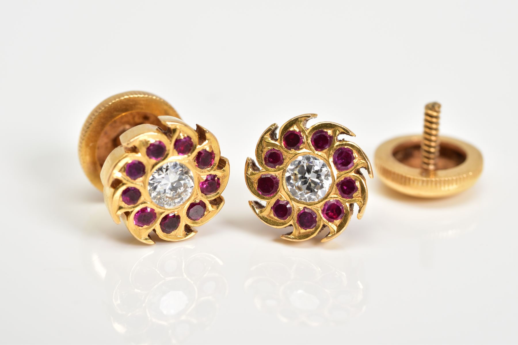A PAIR OF RUBY AND DIAMOND ROUND STUD EARRINGS, centering on a round brilliant cut diamond