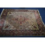A LATE 20TH CENTURY WOOLLEN RED AND CREAM GROUND CARPET SQUARE, approximately 358cm x 274cm (