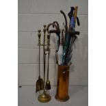 A TALL EARLY 20TH CENTURY BRASS FIVE PIECE COMPANION SET, comprising a shovel, brush, tongs and a