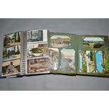 A COLLECTION OF APPROXIMATELY THREE HUNDRED AND THIRTY TWO POSTCARDS IN TWO ALBUMS, featuring one