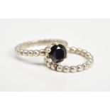 TWO PANDORA RINGS, the first set with a circular cut onyx within a six claw setting, with