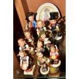 A COLLECTION OF NINE HUMMEL FIGURES, another similar figure and an oval print of Hummel style