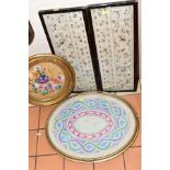 TWO FRAMED NEEDLEWORK SAMPLERS, the first depicting wild flowers with oval gilt frame, maximum