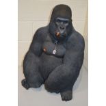 A MODERN RESIN LIFE SIZE FIGURE OF A GORILLA, height 78cm