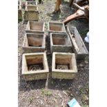 A SET OF FOUR SQUARE COMPOSITE GARDEN PLANTERS, 35cm square x 30cm high, a pair of similar planters,