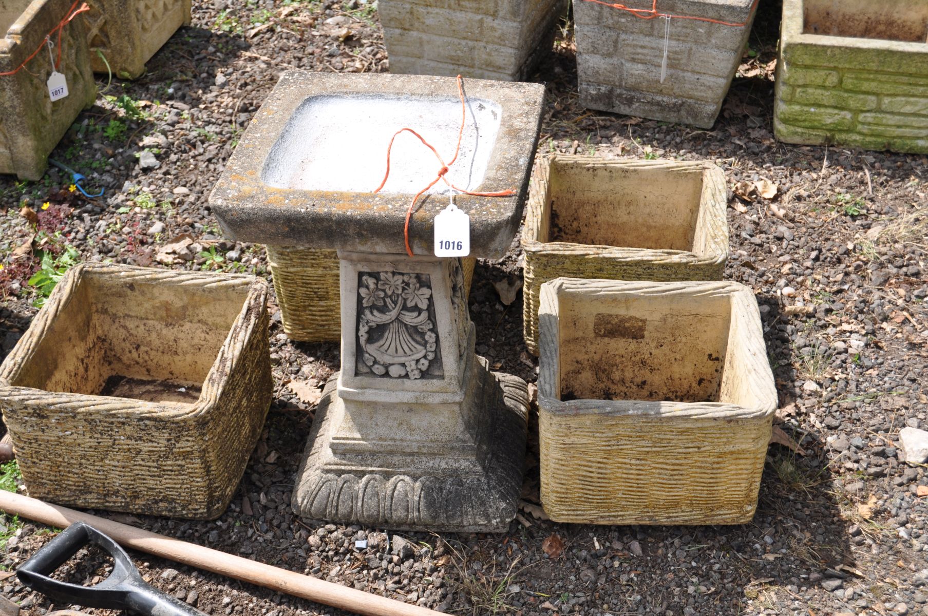 A SQUARE SECTION COMPOSITE GARDEN BIRD BATH, with foliate detail to base, 36cm square, 53cm high and