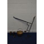 A WROUGHT IRON INGLENOOK CRANE, with two hooks, together with a fire cooking pot, a vintage brass