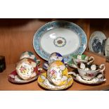 A PARAGON BONE CHINA HARLEQUIN SET OF SIX TEA CUPS AND SAUCERS, each printed to the cup interior and