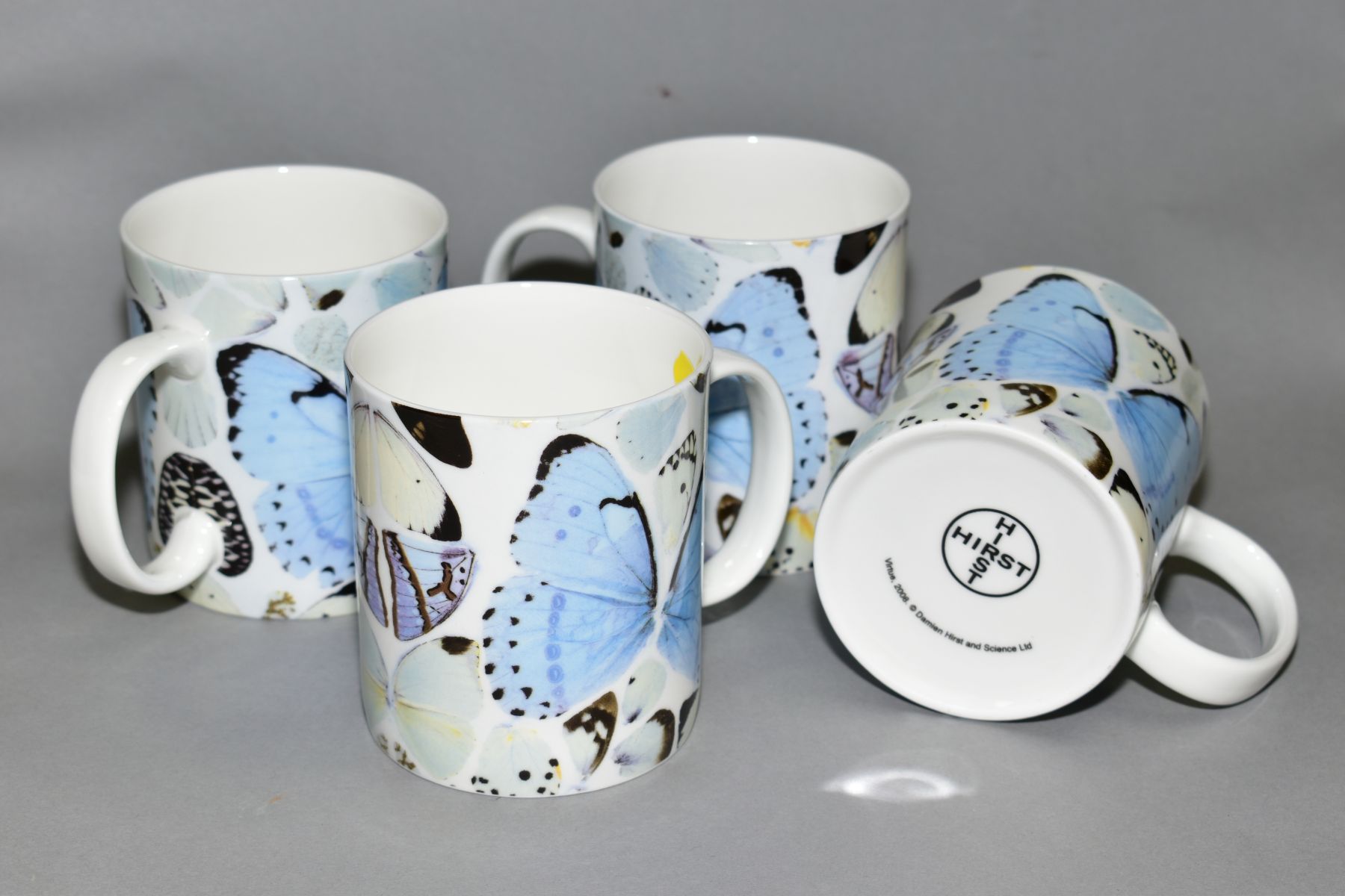 DAMIEN HIRST (BRITISH 1965) 'VIRTUE' four porcelain mugs with butterfly wing design, Hirst/Hirst