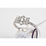 A DIAMOND CLUSTER RING, the cluster of bow shape design set with round brilliant cut and baguette