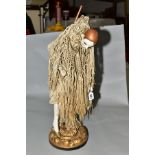 A TABLE LAMP MODELLED AS A 1920'S STYLE WOMAN, composition head with painted features and hair,