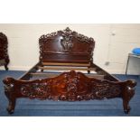 A REPRODUCTION FRENCH STYLE MAHOGANY 5' BED FRAME, with heavy carved and scrolled decoration to